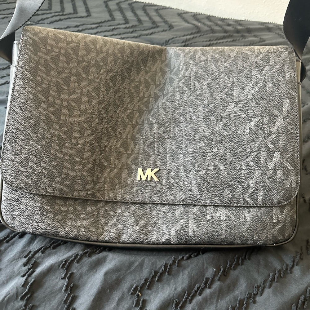Michael Kors Black and Gray Logo Messenger Bag holds a laptop
